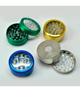 Grinder para marihuana con botón y tapa transparente.