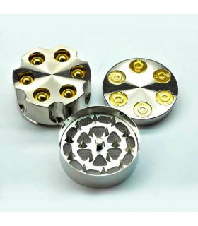 Grinder para marihuana con forma de revólver y polinizador.